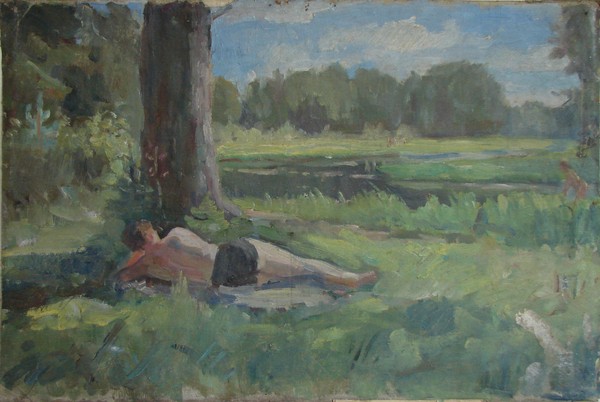 Мужчина, лежащий под деревом.